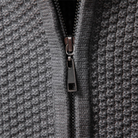 Men's zip up cardigan in soft black knit featuring a stylish stand collar and intricate cable knit design, perfect for layering in cooler weather. 4