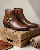 Men's black ankle boots featuring a stylish harness strap and pointed toe, crafted from polished leather for a sleek and sophisticated look. 1