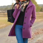 Mid length wool coat for women featuring a high collar, made from warm wool-blend fabric, designed for an elegant fit above the knee. 1
