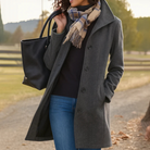 Mid length wool coat for women featuring a high collar, made from warm wool-blend fabric, designed for an elegant fit above the knee. 3