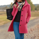 Mid length wool coat for women featuring a high collar, made from warm wool-blend fabric, designed for an elegant fit above the knee. 8