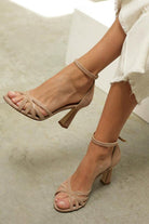 Nude block heel sandals featuring an elegant strappy design and ankle strap for enhanced comfort and style. 0