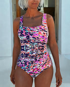 Multi-color printed one piece swimsuit for women featuring tummy control and adjustable straps, perfect for a flattering fit at the beach or pool. 3