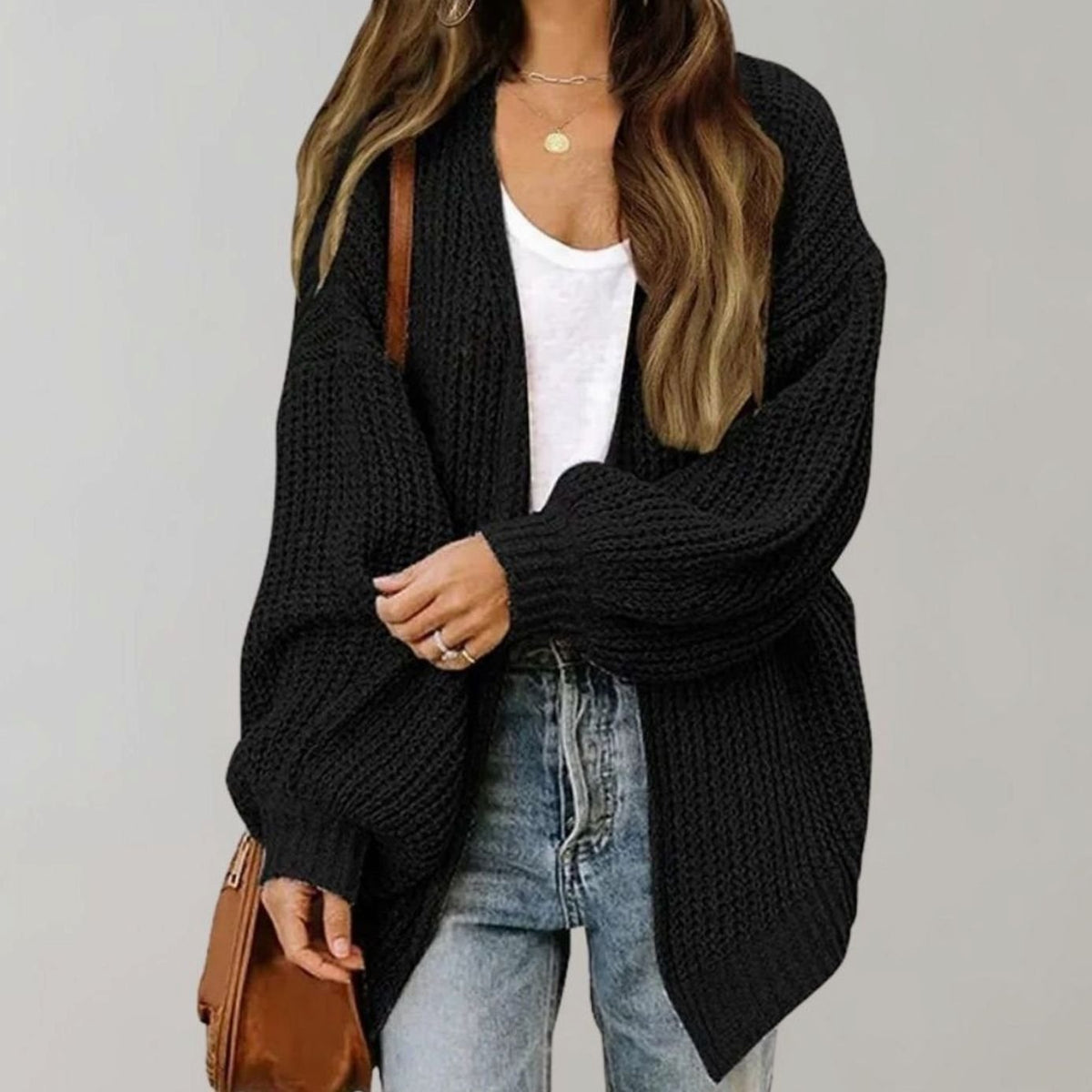 Oversized chunky knit cardigan with balloon sleeves, featuring a soft open front design, perfect for women's layering in cool weather. 0