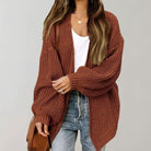 Oversized chunky knit cardigan with balloon sleeves, featuring a soft open front design, perfect for women's layering in cool weather. 1