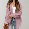Oversized chunky knit cardigan with balloon sleeves, featuring a soft open front design, perfect for women's layering in cool weather. 3