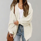 Oversized chunky knit cardigan with balloon sleeves, featuring a soft open front design, perfect for women's layering in cool weather. 4