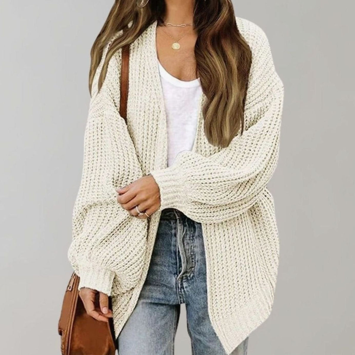 Oversized chunky knit cardigan with balloon sleeves, featuring a soft open front design, perfect for women's layering in cool weather. 4