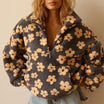 Oversized floral teddy fleece jacket with half zip featuring a retro daisy print and cozy texture, perfect for stylish warmth and comfort. 0
