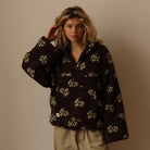 Oversized floral teddy fleece jacket with half zip featuring a retro daisy print and cozy texture, perfect for stylish warmth and comfort. 8