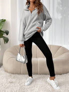 Oversized women's hoodie with a half zip collar and kangaroo pocket, made from soft fleece for a cozy casual look. 1