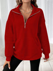 Oversized women's hoodie with a half zip collar and kangaroo pocket, made from soft fleece for a cozy casual look. 2
