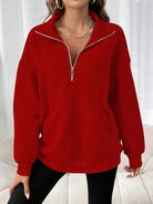 Oversized women's hoodie with a half zip collar and kangaroo pocket, made from soft fleece for a cozy casual look. 2