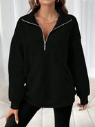 Oversized women's hoodie with a half zip collar and kangaroo pocket, made from soft fleece for a cozy casual look. 4