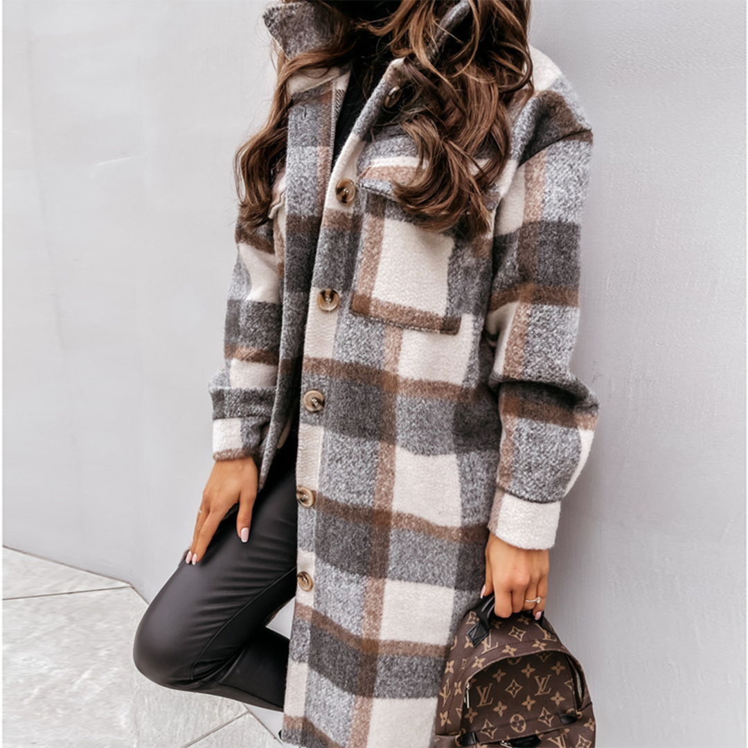 Oversized plaid shacket featuring a button front and chest pockets, designed for women, perfect for casual layering in a wool-style fabric. 1