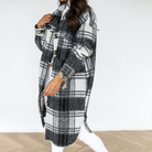 Oversized plaid shacket featuring a button front and chest pockets, designed for women, perfect for casual layering in a wool-style fabric. 3