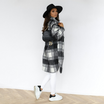 Oversized plaid shacket featuring a button front and chest pockets, designed for women, perfect for casual layering in a wool-style fabric. 4