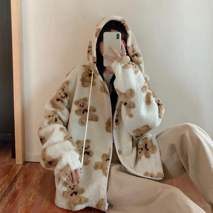 Oversized Sherpa jacket featuring a whimsical teddy bear print and an attached hood, perfect for cozy casual wear in cold weather. 3
