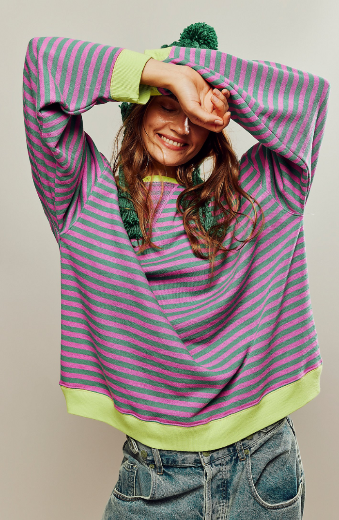 Oversized striped sweatshirt featuring neon contrast trim and drop shoulders, perfect for a stylish and comfortable casual look. 0