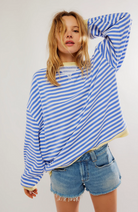 Oversized striped sweatshirt featuring neon contrast trim and drop shoulders, perfect for a stylish and comfortable casual look. 2