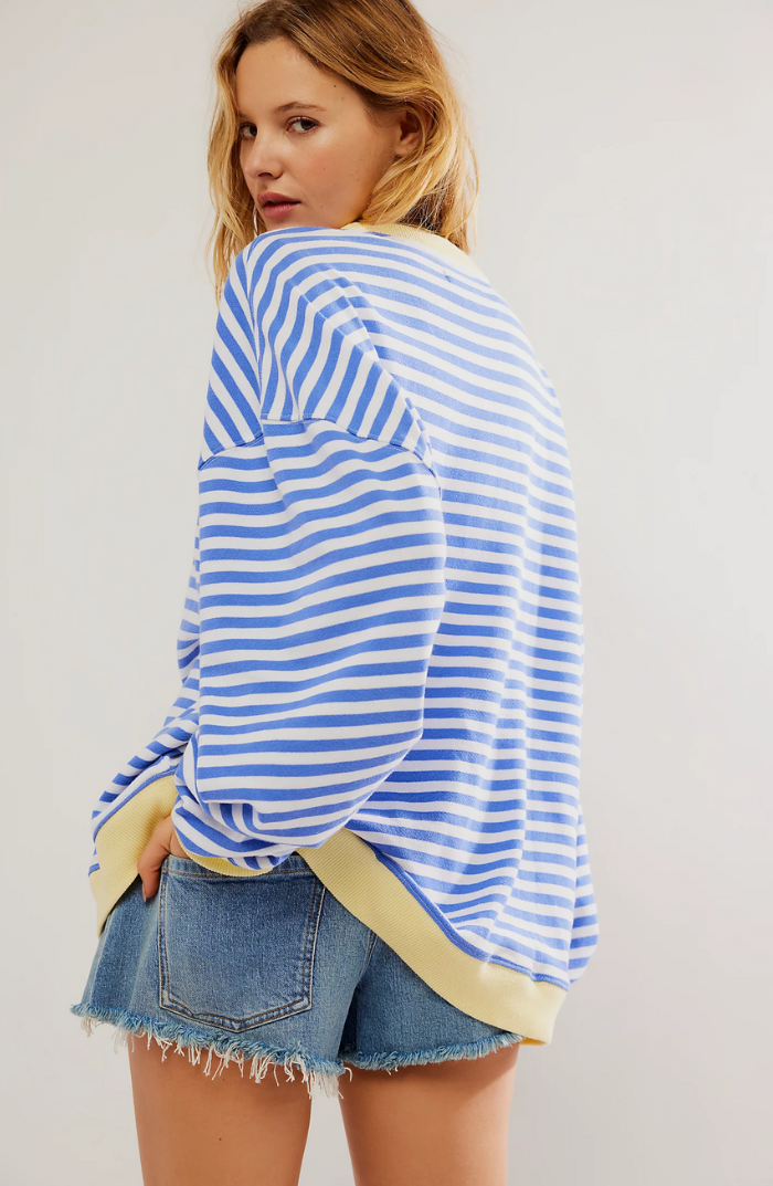 Oversized striped sweatshirt featuring neon contrast trim and drop shoulders, perfect for a stylish and comfortable casual look. 3