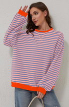 Oversized striped sweatshirt featuring neon contrast trim and drop shoulders, perfect for a stylish and comfortable casual look. 4