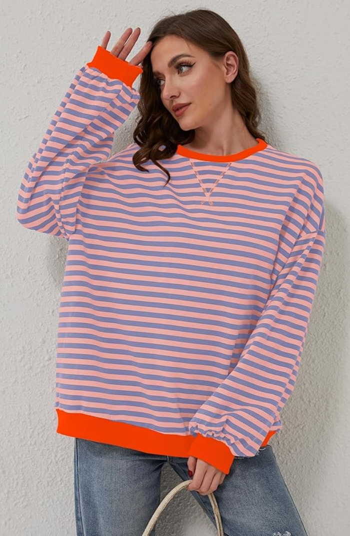 Oversized striped sweatshirt featuring neon contrast trim and drop shoulders, perfect for a stylish and comfortable casual look. 4