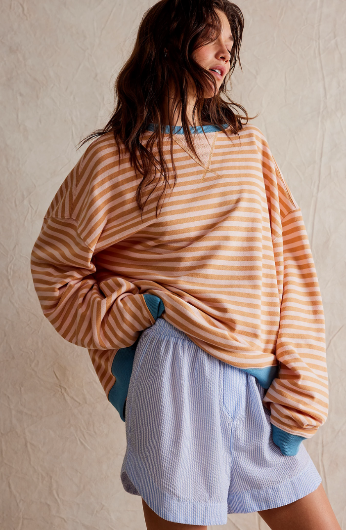 Oversized striped sweatshirt featuring neon contrast trim and drop shoulders, perfect for a stylish and comfortable casual look. 6