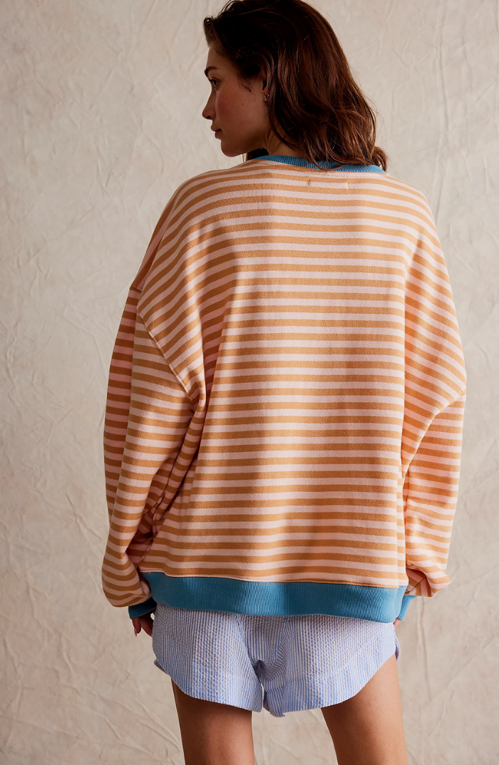 Oversized striped sweatshirt featuring neon contrast trim and drop shoulders, perfect for a stylish and comfortable casual look. 7