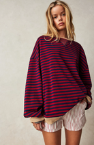 Oversized striped sweatshirt featuring neon contrast trim and drop shoulders, perfect for a stylish and comfortable casual look. 8