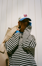 Oversized striped sweatshirt featuring neon contrast trim and drop shoulders, perfect for a stylish and comfortable casual look. 9