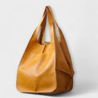 Oversized weekend bag in durable PU leather featuring a versatile design, perfect for stylish travel as a shoulder bag for women. 0