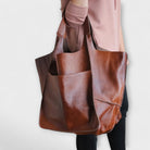 Oversized weekend bag in durable PU leather featuring a versatile design, perfect for stylish travel as a shoulder bag for women. 4