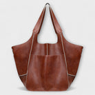 Oversized weekend bag in durable PU leather featuring a versatile design, perfect for stylish travel as a shoulder bag for women. 5