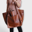 Oversized weekend bag in durable PU leather featuring a versatile design, perfect for stylish travel as a shoulder bag for women. 9
