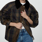Plaid jacket featuring a corduroy collar and snap buttons, designed with a relaxed fit and hip length, showcasing a stylish tartan check print. 0