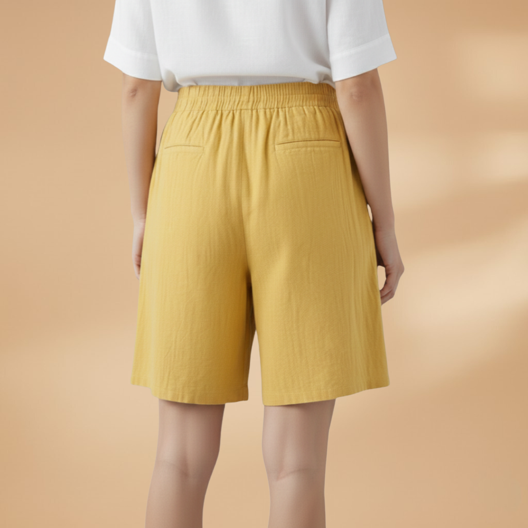 Lightweight relaxed linen shorts for women featuring an elastic waist and drawstring, perfect for summer wear. 1