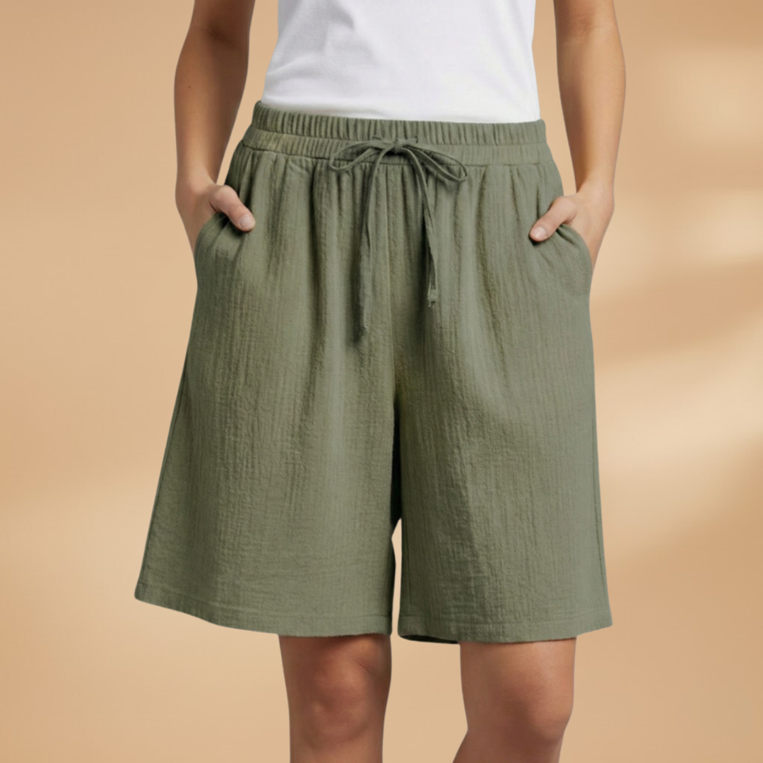 Lightweight relaxed linen shorts for women featuring an elastic waist and drawstring, perfect for summer wear. 3