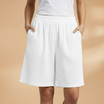Lightweight relaxed linen shorts for women featuring an elastic waist and drawstring, perfect for summer wear. 7