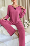 Ribbed knit women's pajama set featuring a relaxed full-length fit, lettuce edge detailing, and satin bow accent, available in rose pink, grey 0