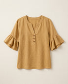 Ruffle blouse with V-neckline and decorative buttons, showcasing a feminine elegant design in soft fabric, perfect for stylish casual or formal wear. 4
