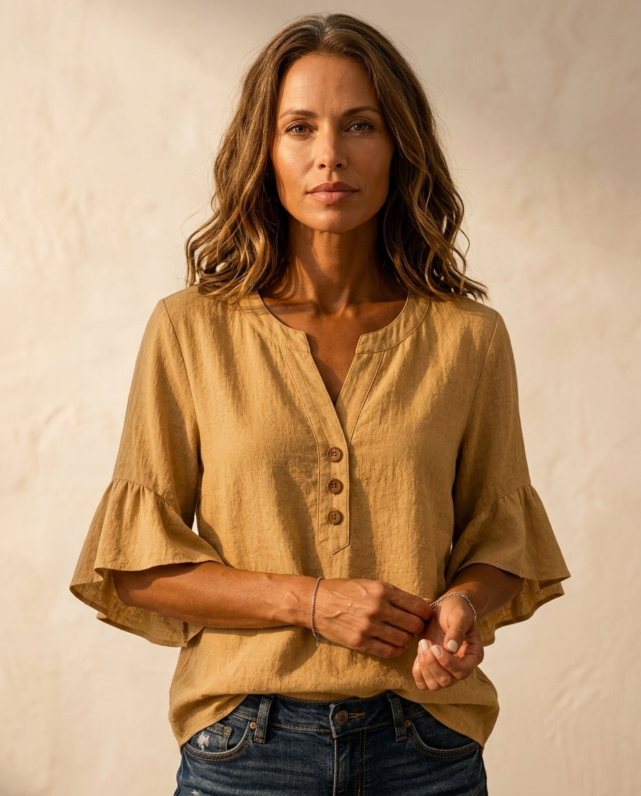 Ruffle blouse with V-neckline and decorative buttons, showcasing a feminine elegant design in soft fabric, perfect for stylish casual or formal wear. 5