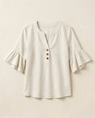 Ruffle blouse with V-neckline and decorative buttons, showcasing a feminine elegant design in soft fabric, perfect for stylish casual or formal wear. 6