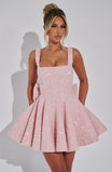 Sequin mini dress with flared skirt and back bow detail, perfect for wedding guests and cocktail parties. 0