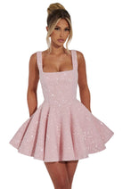 Sequin mini dress with flared skirt and back bow detail, perfect for wedding guests and cocktail parties. 1