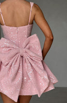 Sequin mini dress with flared skirt and back bow detail, perfect for wedding guests and cocktail parties. 6