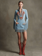 Short blue faux suede dress featuring intricate embroidery and playful tassels, perfect for a stylish Western-inspired look. 1