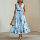 Sleeveless floral maxi dress featuring a pleated design and elegant V-neck, perfect for women's summer fashion. 2