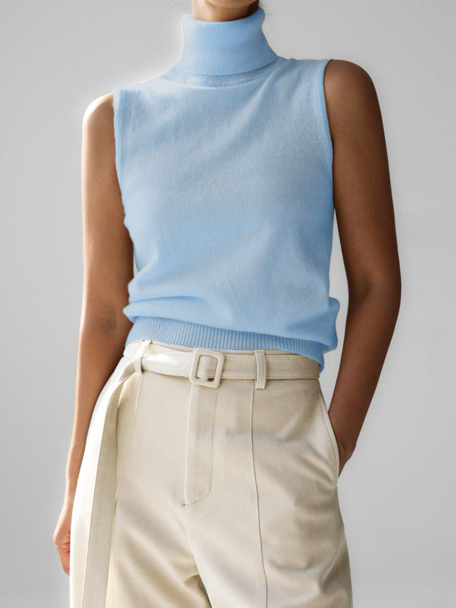 Sleeveless knit top for women featuring a soft turtleneck design and ribbed hem, perfect for layering or wearing alone. 2
