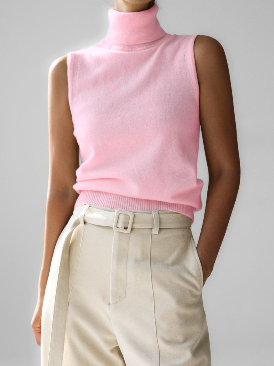 Sleeveless knit top for women featuring a soft turtleneck design and ribbed hem, perfect for layering or wearing alone. 3